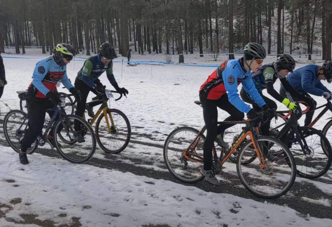 Cyclists racing in snow