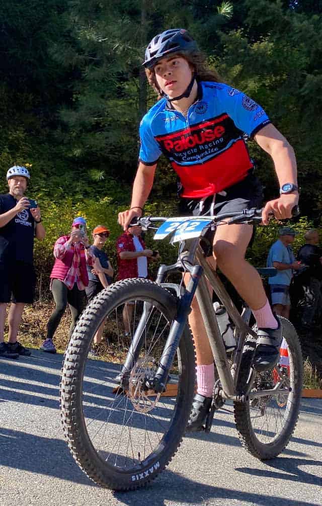 bicycle racer on mountain bike course