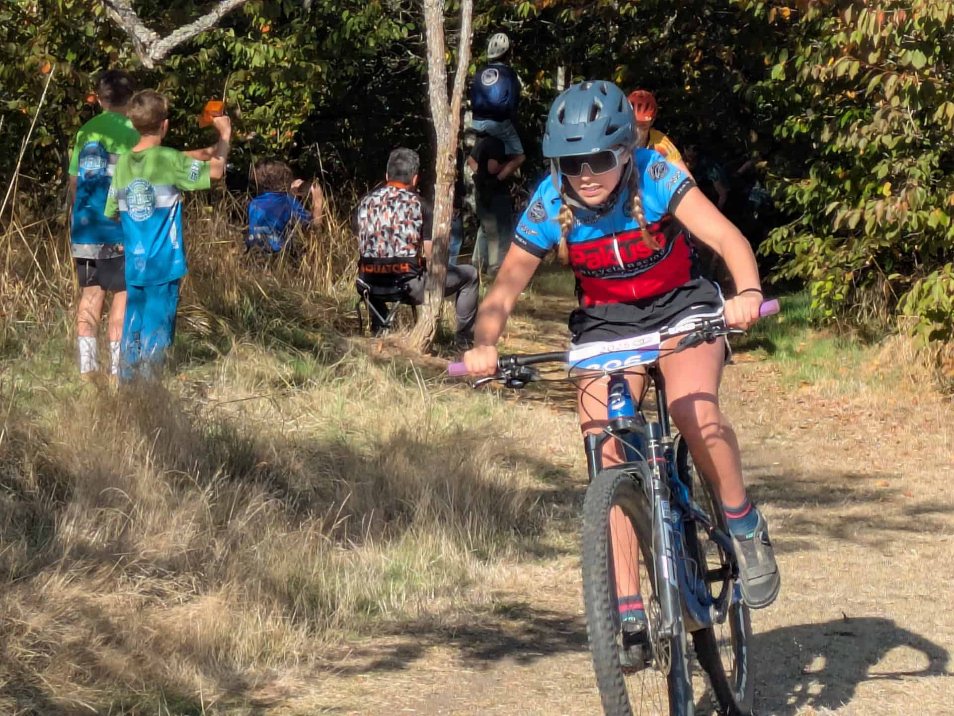 Person riding bicycle in race. 