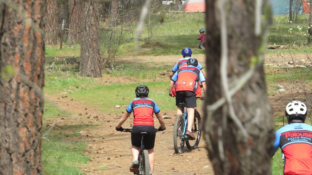 Palouse Bicycle Racing team on practice ride in forest
