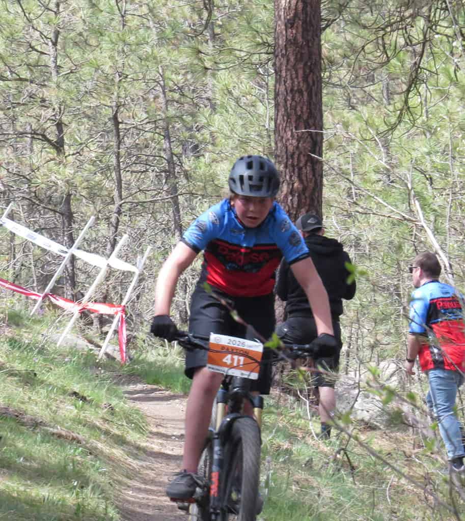 Rider on bike on forest trail